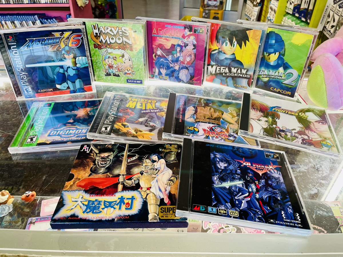 A cartridge game has sneakily disguised itself among these disc-format hits just in at our International District location! Can you spot it?