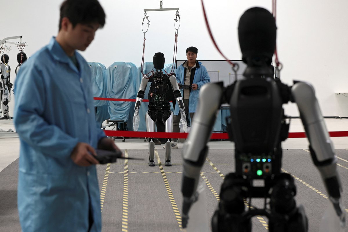 Reuters's tweet photo. 🔊 Folding T-shirts and cleaning toilets — hear about the work involved in training humanoid robots on Reuters Econ World podcast https://t.co/orspz9LZRA https://t.co/XcQIXgYHDI