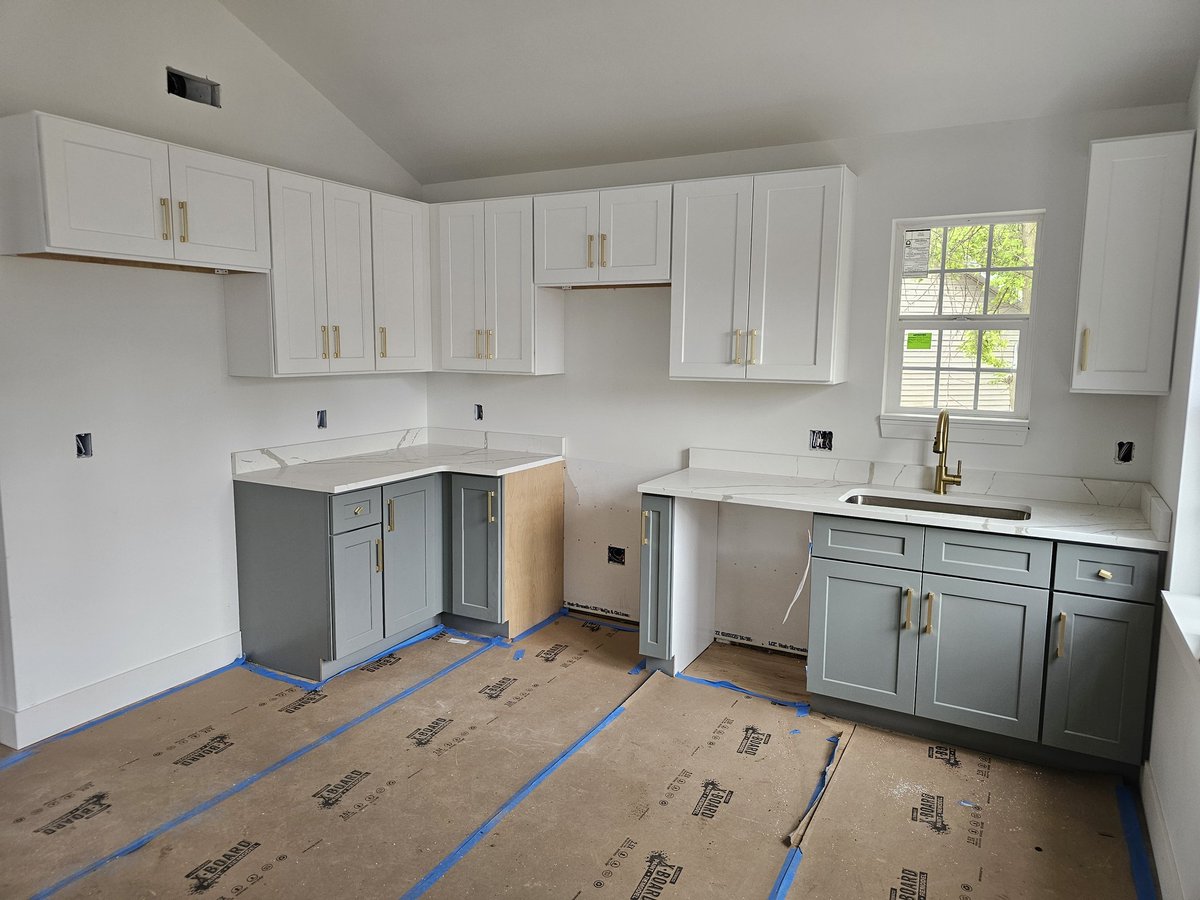 Which kitchen color combo do you like better?

All White Cabs/Granite/Black Pulls

OR

Two-Tone Cabs, White Uppers, Basil Lowers/Calacatta Quartz/Champagne Bronze Pulls