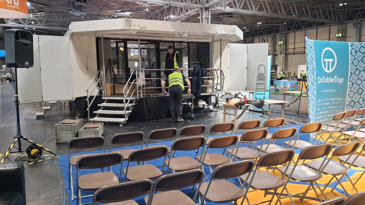 Stage is also coming together nicely with our brave volunteers doing most of the graft - at least we feed them...occasionally #UKGamesExpo #UkGE2025