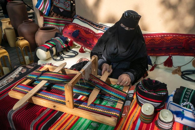 Kente as woven in Bonwire didn't originate from Agbozume. So nobody is going to pay homage to you. Now, a bit of free education for you. Before the industrial revolution, almost every culture in the world had a way of making textiles. Handloom goes back thousands of years. In the