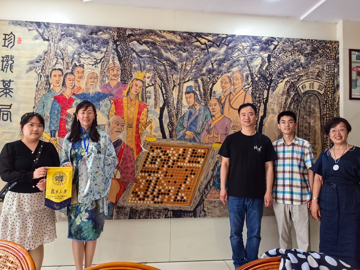 goandmath's tweet image. Professor Aimee Ye (Pro 3-Dan) from Fudan University is traveling between cities in China to advocate for the Go and Math teaching approach and to support the integration of the Go game into math classrooms. The mural in the background features a famous bestiary puzzle (tsumego)