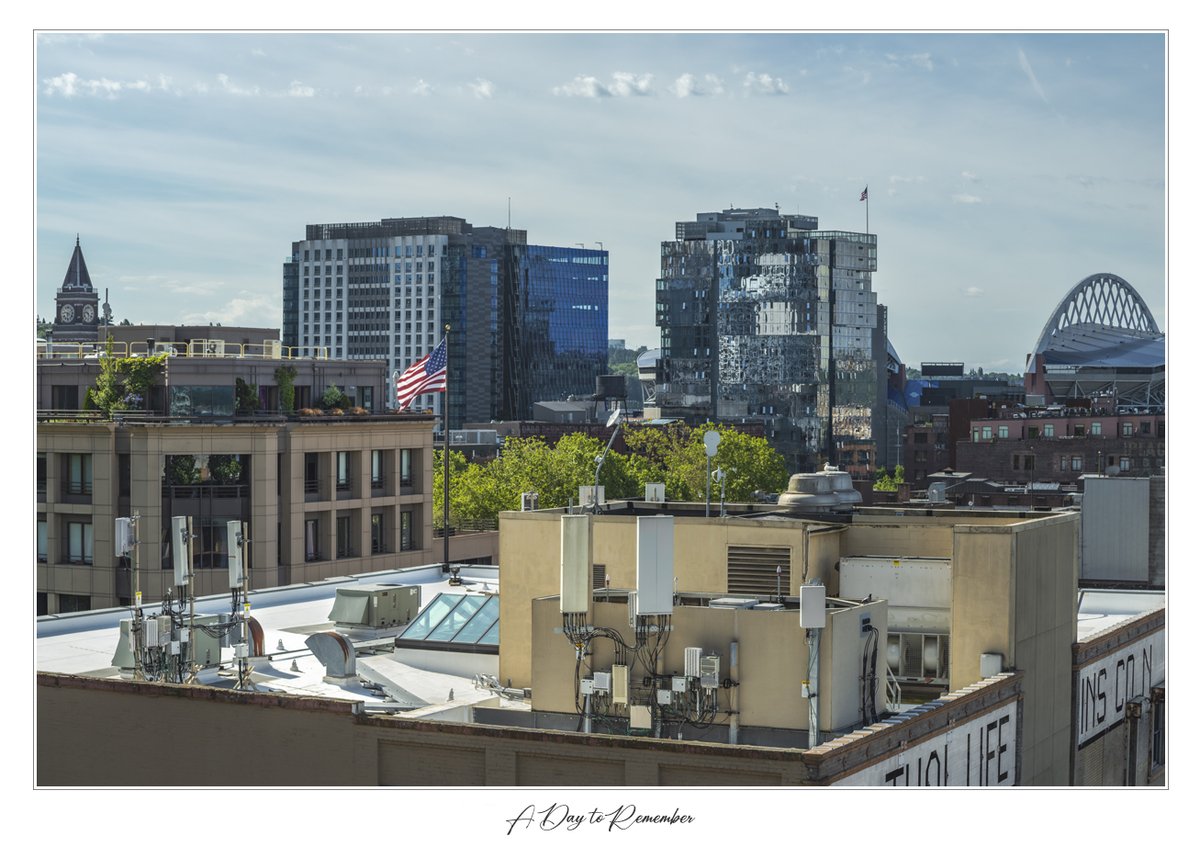 A Day to Remember 2025
This image features a rooftop view of Seattle, WA. A pair of flags blowing in the wind on Memorial Day, a day to remember.

#louisruthphotography #architecture #Seattle #art
