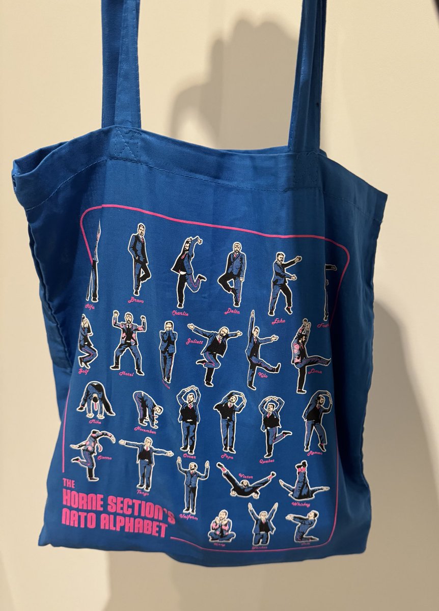 showing off my horne section merch!