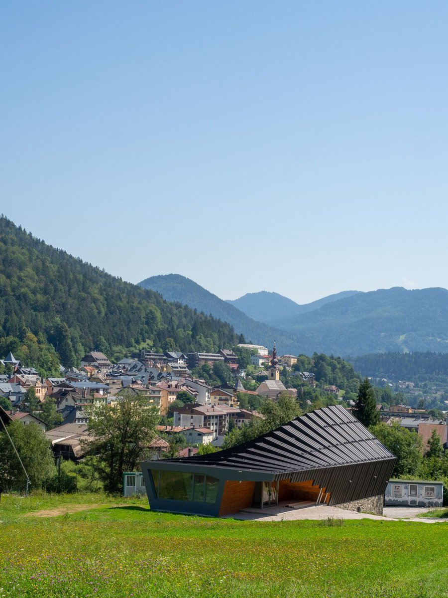 Archello's tweet photo. Studio Beltrame’s Tarvisio Ski School reinterprets alpine tradition through a tiered wavy roof and a structure of local timber and black metal. 
https://t.co/aGOHgDM8q6

#TimberArchitecture #AlpineDesign #MaterialsInContext https://t.co/uWI2RsUAjJ