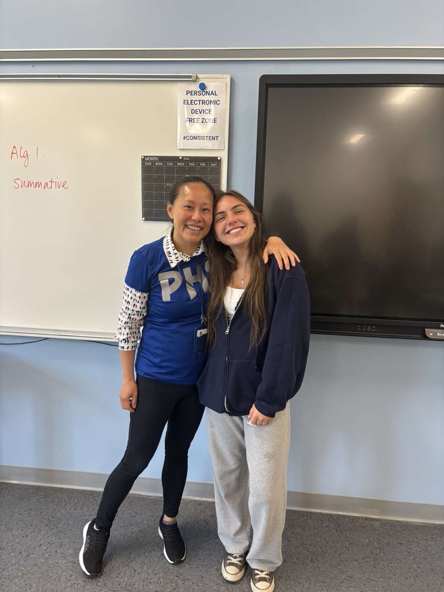 Pelham Softball senior Bella Furtado presenting her jersey and an appreciation card to teacher Jen Cheatham as part of the team’s “My jersey, your inspiration” program.