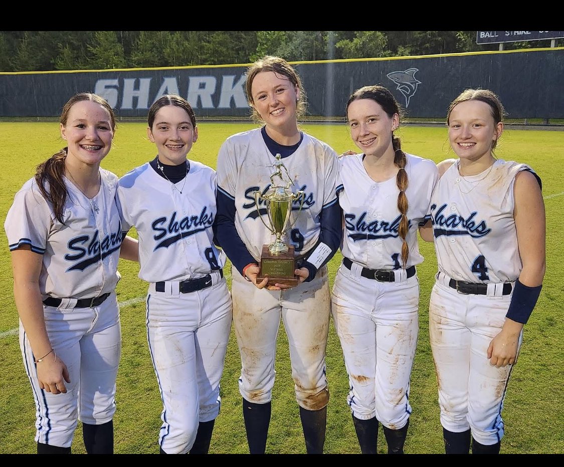 kiley_nichols08's tweet photo. DISTRICT CHAMPS!! 
First time since 2019! So proud of my team and coaches!! Pictured with four of my fellow Stars Showcase teammates! 
#sharkssoftball 
#colgan
 #starsshowcasesoftball https://t.co/3BM1FrdBOu