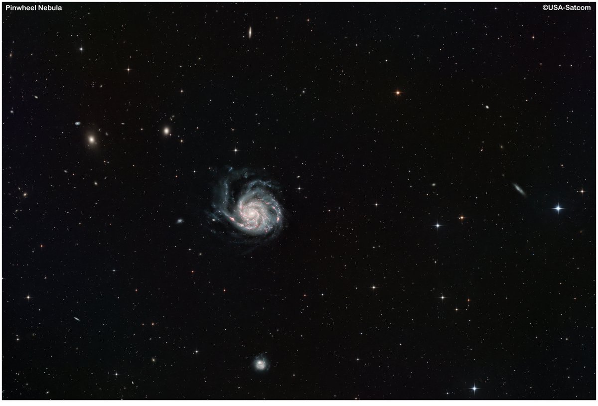 Pinwheel Galaxy (M101). 25M lightyears away. 17 hours of subs, RGB + Ha. Several other galaxies also visible.