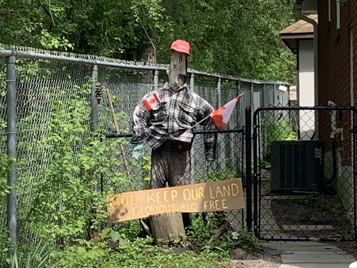 Sad scene outside PIckering house where senior named Elenor was stabbed to death on Thurs afternoon. People are leaving flowers &amp; neighbors say they loved her scarecrow that she would dress for occasions (now in Canada Day mode). A 14 y.o. Boy has been charged w 1st degree murder