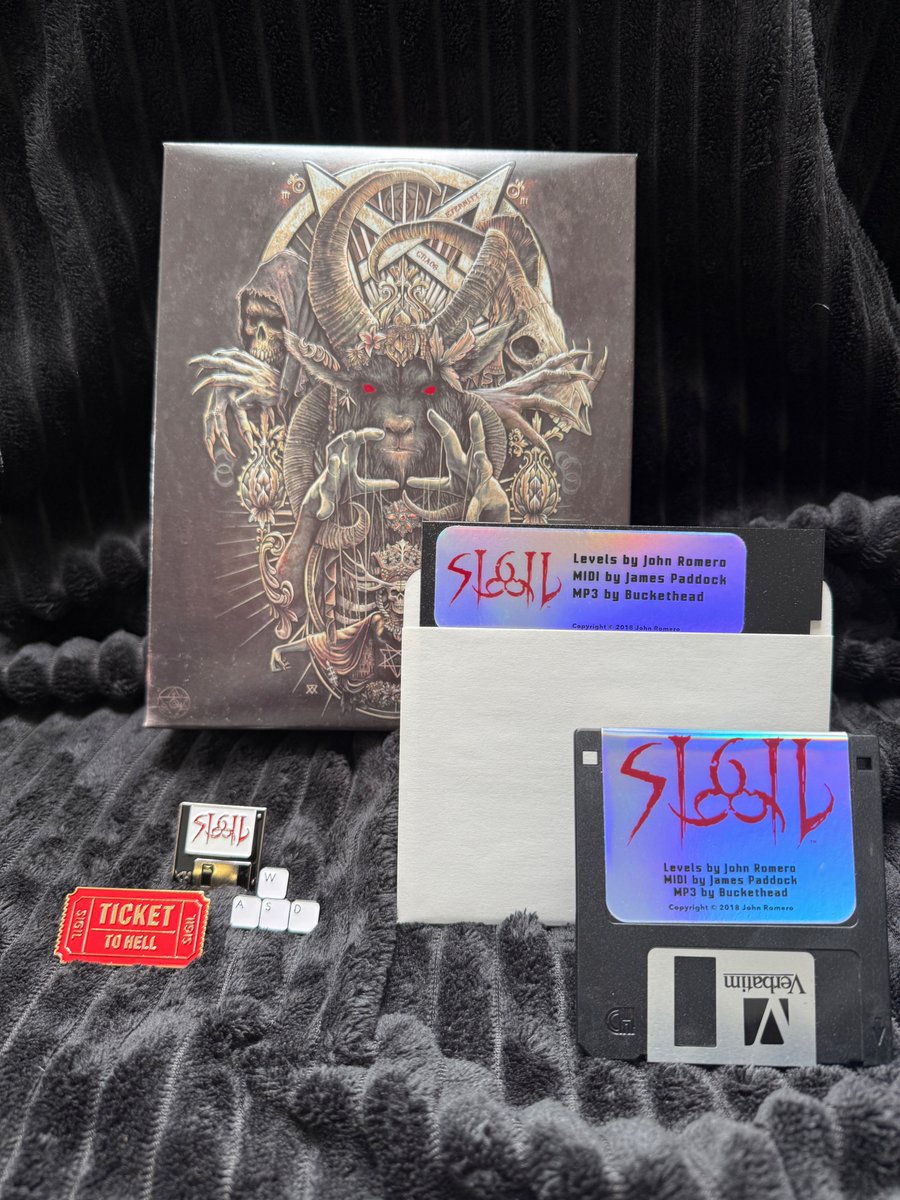 romero's tweet image. Ships next week! The original SIGIL in a new embossed foil box w/real 5.25" and 3.5" disks. Runs on classic machines & you get a digital download! New merch includes three pins, a foil sticker sheet, cover art poster and cinch bag. While supplies last. Romero.com.