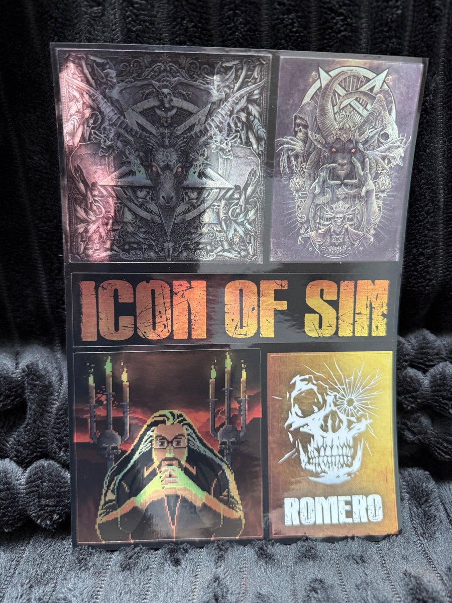 romero's tweet image. Ships next week! The original SIGIL in a new embossed foil box w/real 5.25" and 3.5" disks. Runs on classic machines & you get a digital download! New merch includes three pins, a foil sticker sheet, cover art poster and cinch bag. While supplies last. Romero.com.