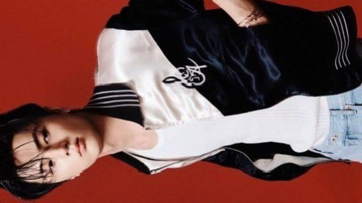 Upon a field of  scarlet     light    he     stands,  
A knight of   fabric,   satin’s    gentle   sheen,  
With     black     and    white,  his    Pamelloto 
jewelry charms in his hands,  A quiet grace 
where fashion reigns supreme.