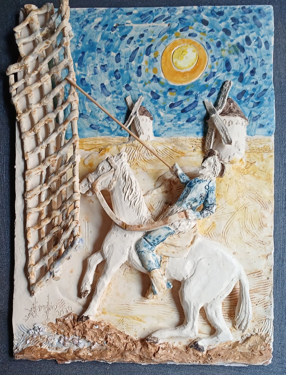 Pues esto es uno de mis pequeños murales de cerámica. D. Quijote atacando un gigante-molino.