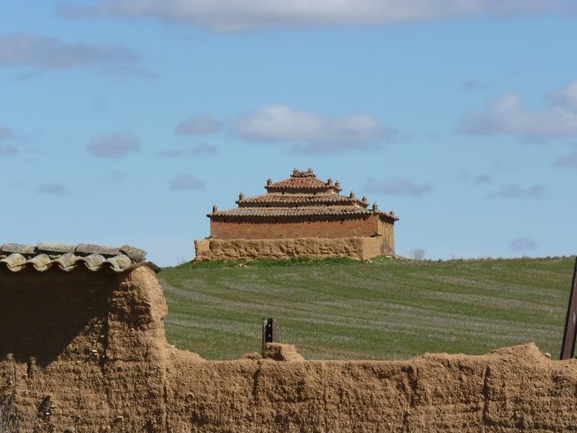 Palomar, Tierra de Campos, Zamora. These dovecotes are an essential architectural +landscape feature of the Castillian wheatlands. Usually built with adobe by wealthy and used as source of meat, eggs, and valuably, pigeon guano for fertiliser+making gunpowder. Many crumbling now