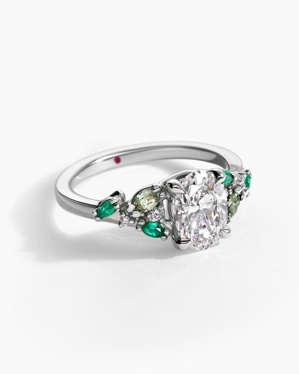 The marquise emeralds and sapphires proudly surround the 1.25ct oval diamond at the centre. Set in a cool tone platinum, it is a subtle celebration of the verdant May birthstone 🤍💚

 #diamondring #maybirthstone #platinumjewellery