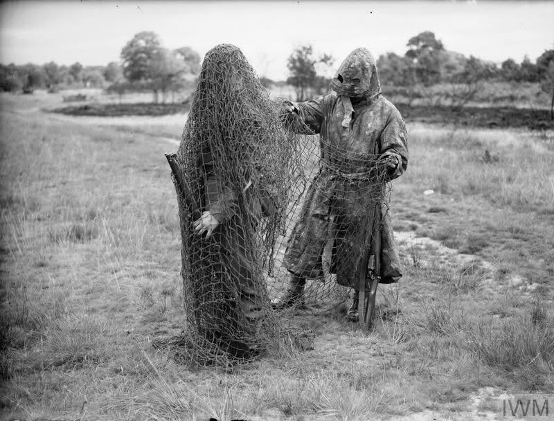 🇬🇧Two Lovat Scouts pictured in sniper camouflage, Bisley, Surrey, 9 July 1940.
&gt; IWM (H 2145)