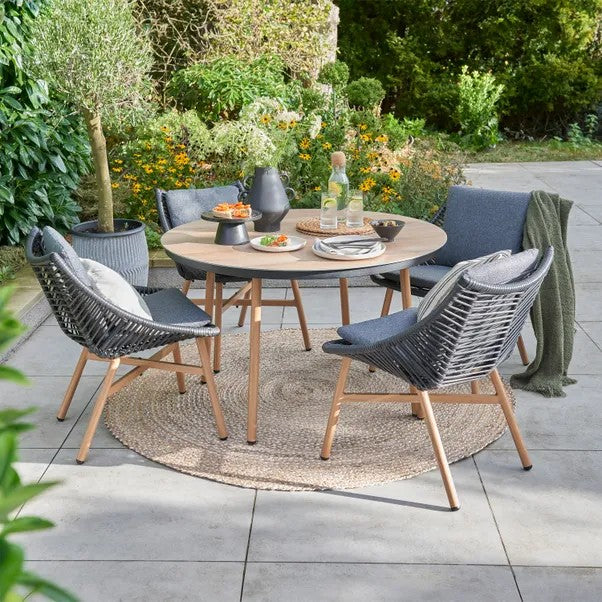 The Keswick 4 Seat Dining Set combines elegance &amp; practicality  equally suited to a garden or conservatory. Bistro set &amp; 6 Seater also available.A spacious  Beech table top &amp;  black flat wicker seats offer lasting quality and comfort. Dark Stone Grey cushions 4 chairs. £895