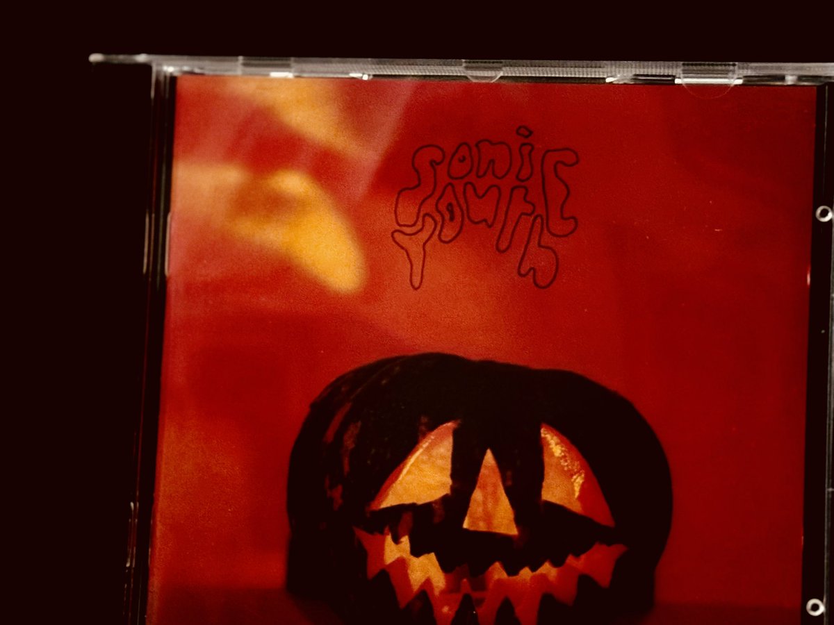 EditorofFist's tweet photo. Walls Have Ears 

Sonic Youth (1986) 

Dissonance as art - the attempt to puncture the idea that the world is harmonious and truly  endearing: the opposite end of the line to the US schmaltzfest. 

Behind the cooing for Teddy Bears and sighing for Momma, lies the ‘psychotic colon’. It is filled with indigested effluvia of over-processed manufactured mush. The owner is destined for an early death. 

Sonic Youth tapped into those life flows: the same vitriolic levels of anger that raged throughout the 1980’s pours into these sonic veins. Cathedrals of electronic squalls  wash over a time of great economic dislocation: the world seemed void, bereft and without hope or vision. Reagan and Thatcher had stepped in; the future of humanity lay in constant acquisition and hoarding. 

Art later suffered as a result of increased patronage, with  an audience suffused with growing satiation. As material conditions changed, so did outlook and demeanour. The raw energies of the 1980s dissipated: they became turned out into monetary signs and values. Hoarding then  became de rigeur. 

Here the attempts to capture a world lying beyond the modern mundane: they  are harnessed in free-flow jams. 1960s epic encounters between harmony and its antithesis -  ‘clang and clash’ - shift away from hippy self-preoccupation around ‘meaning man’: instead they jab, poke and provoke in the slang of the NY punk. 

Manson, another west coast world away from NY - reappears as a New York Ghost - akin to Siouxsie sporting a swastika - the icon of great offence. The man from the Catholic run approved school who later took in the outcasts from lineages and the middle-classes to recreate a family -  casts a long troubled shadow.  In various guises he lives throughout these NY themes - the antithesis to the soft schmaltz porn of the 1970s Waltons. 

Death Valley 69 and the ‘tunes’ culled from the first batch of platters are given rough hewn live work outs: the electricity sizzles and soars. It prickles and then with the full force of a Boeing in a spectacular  throttle : it takes off with pure levels of violence. 

It is a reminiscence piece - a bootleg later reincorporated into the cannon: accepted as a long lost son and given a makeover. It is worth its history to reveal a time and place where the walls may have ears but the ears were remarkably open.