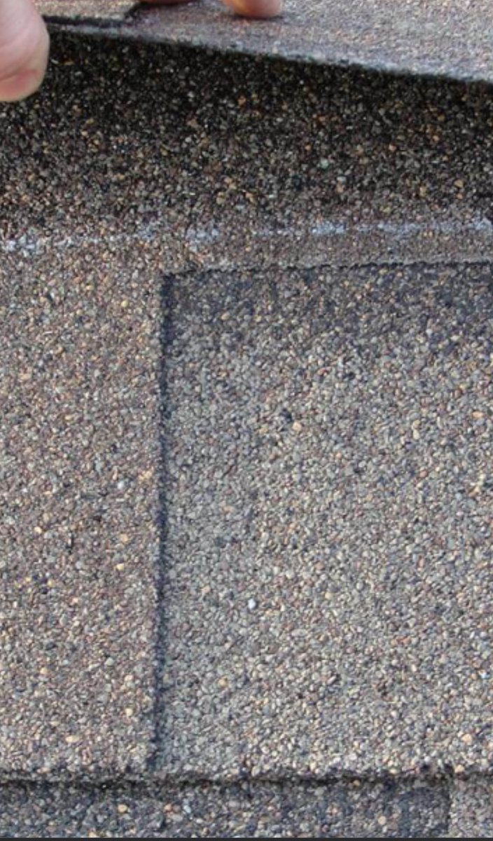 wudduplaynee's tweet photo. @NWordBiden It’s actually the white line because it’s the only spot on the shingle that has the double thickness, anywhere above will guarantee blow throughs when installing nails and blow offs in high wind but go off king 🥴 https://t.co/wAK6qDWWLP