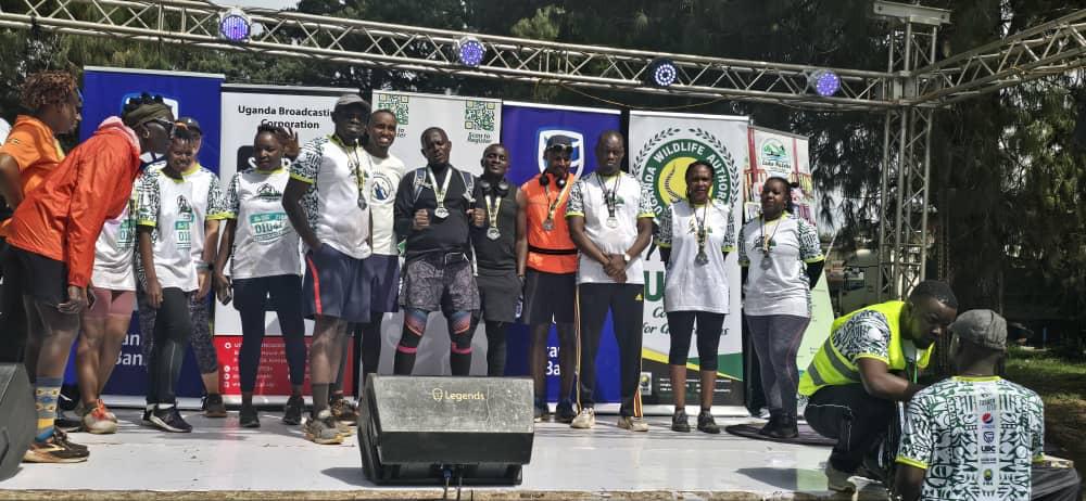 UWA joined the 2nd Virunga Gorilla Marathon in Kisoro this morning, to boost brand visibility, promote national parks, and support climate action. 
Hon. Minister of State for Tourism <a href="/mugarra/">Hon.Bahinduka Mugarra Martin</a> graced the event featuring 42km, 21km, 10km &amp; 6km races.
Protecting nature is a race we