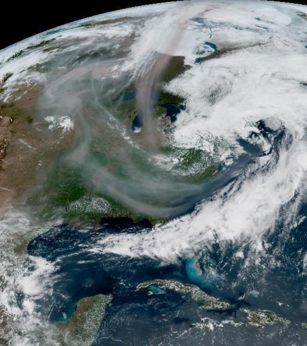Wildfire smoke streaming down into the US from Canada this afternoon. Low pressure over New England also dragging that smoke in.
