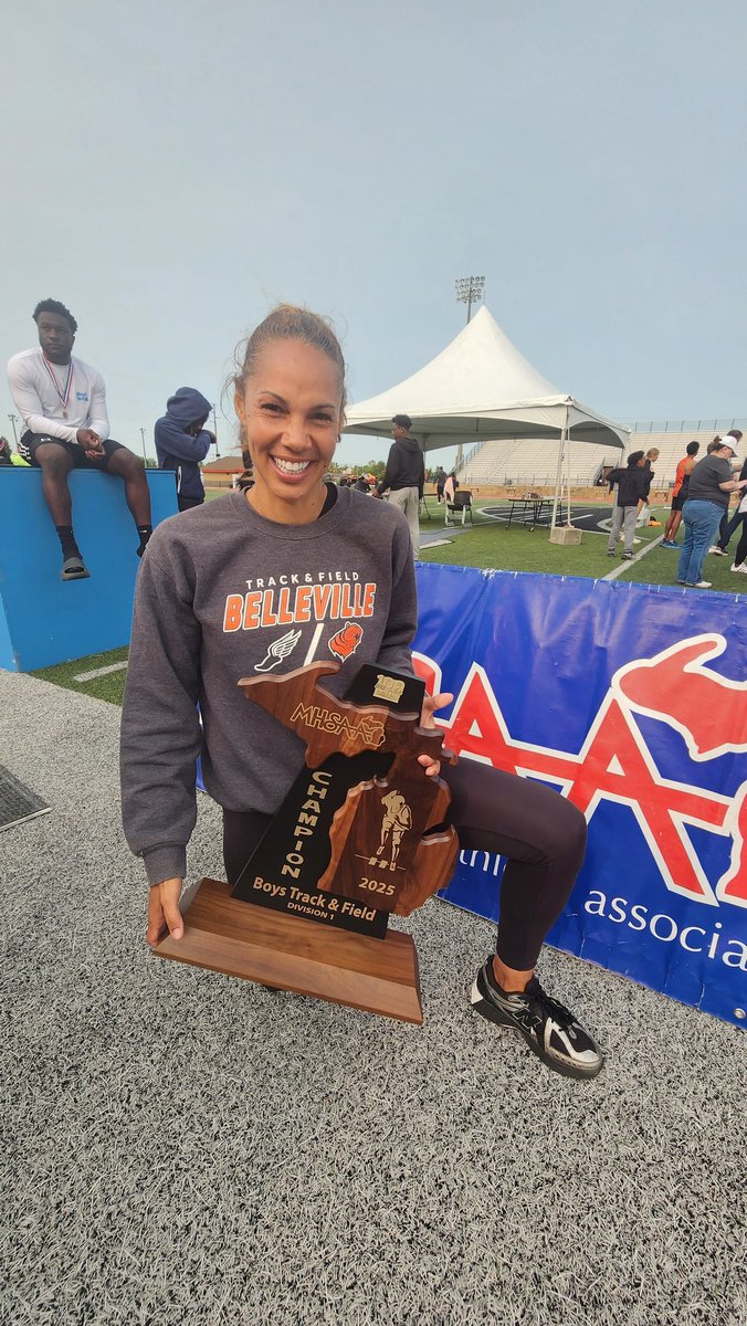 statechampsmich's tweet photo. The 2025 @MHSAA Division 1 Boys Track and Field State Champions title has been awarded to Belleville High School, a milestone representing the school's first track state title.

Furthermore, Belleville head track coach Candice Price achieved a historic feat as the first woman coach in MHSAA history to secure a boys track state title. Candice Price