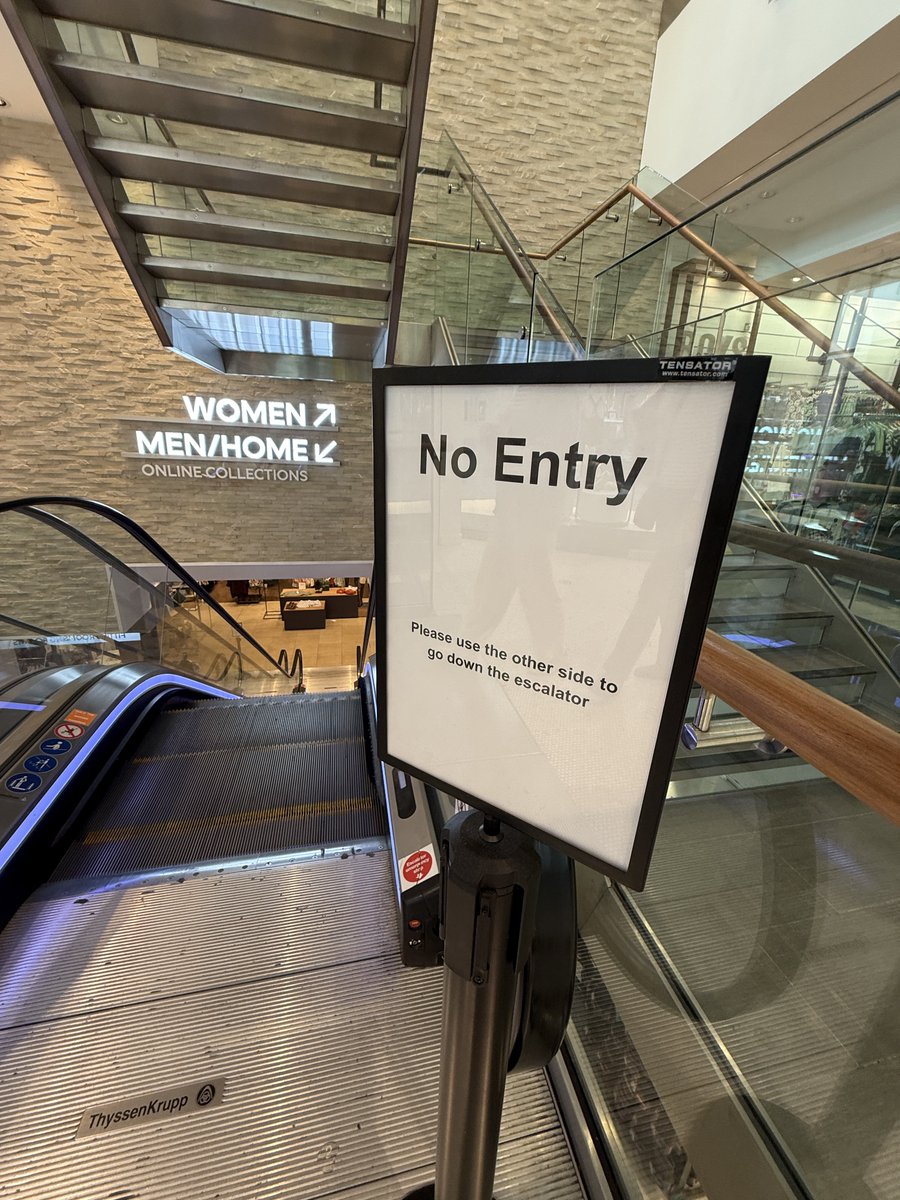 Shopping centre reminds you not to go down an up escalator. What is this wokeness