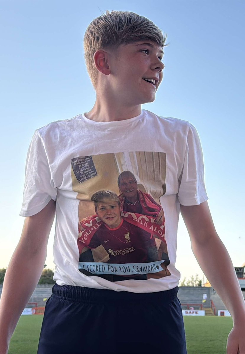 Teamgrassroots_'s tweet photo. This is my 14 year old son Lennon, he plays for a local grassroots football club. This season they made it through to the league cup final. 

Lennon had a close relationship with my dad, (his grandad) and gained his passion and love of football from his grandad. 

My dad (his grandad) became very poorly but PROMISED Lennon he’d be at his cup final and Lennon promised he would score a goal to contribute to winning.

At the end of March my dad sadly passed away - the final wasn’t until the 15th May. 

Lennon had asked me to get him a personalised t-shirt for when he scored so he could take off his  football top to reveal a photo and a quote saying ‘I scored for you Grandad’ - he had it all pictured in his mind.

Going back a bit. My dad was a Firefighter for West Yorkshire Fire Brigade and when he first joined at 16 years old he was given a fire fighter number - that number was 57! 

Lennon DID score, revealed his t-shirt and got a yellow card for it… he scored on the 57th minute!!!!! And they WON the league cup final! 

What are the chances 💙