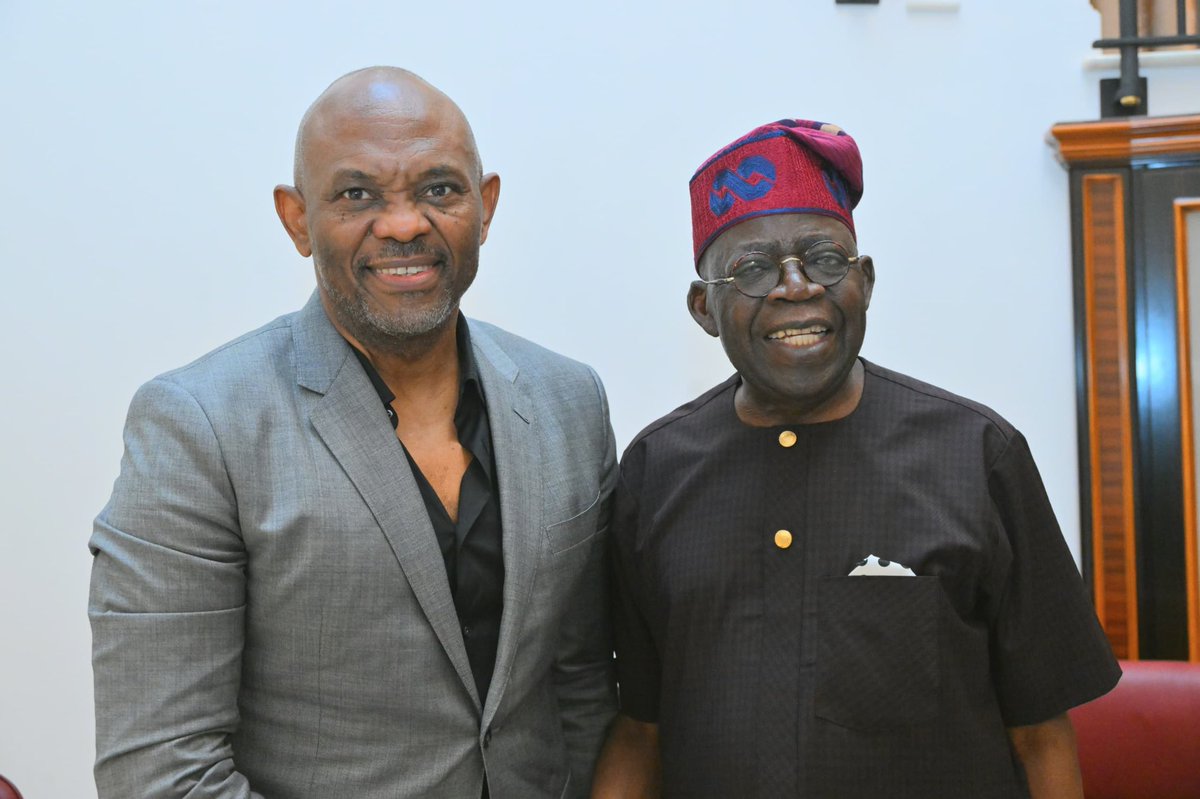 President Tinubu at home Saturday evening with the Chairman of Heirs Holding and UBA group after the commissioning of phase one of the Lagos- Calabar superhighway.