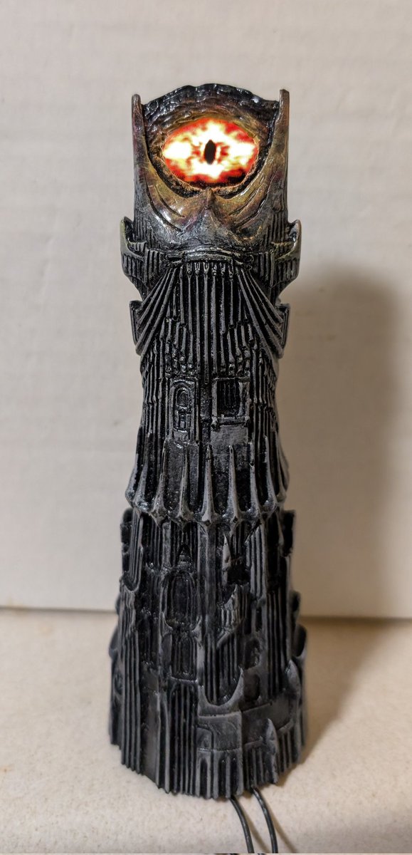 machine_slave's tweet image. In an effort to get back into the pinball business, I've been going through my supplies and came across this prototype I made 10 years ago. It's Barad Dur tower from Lord of the Rings. It uses the original part, with extra sculpting, paint, and OLED and animated eye. #PinballMods