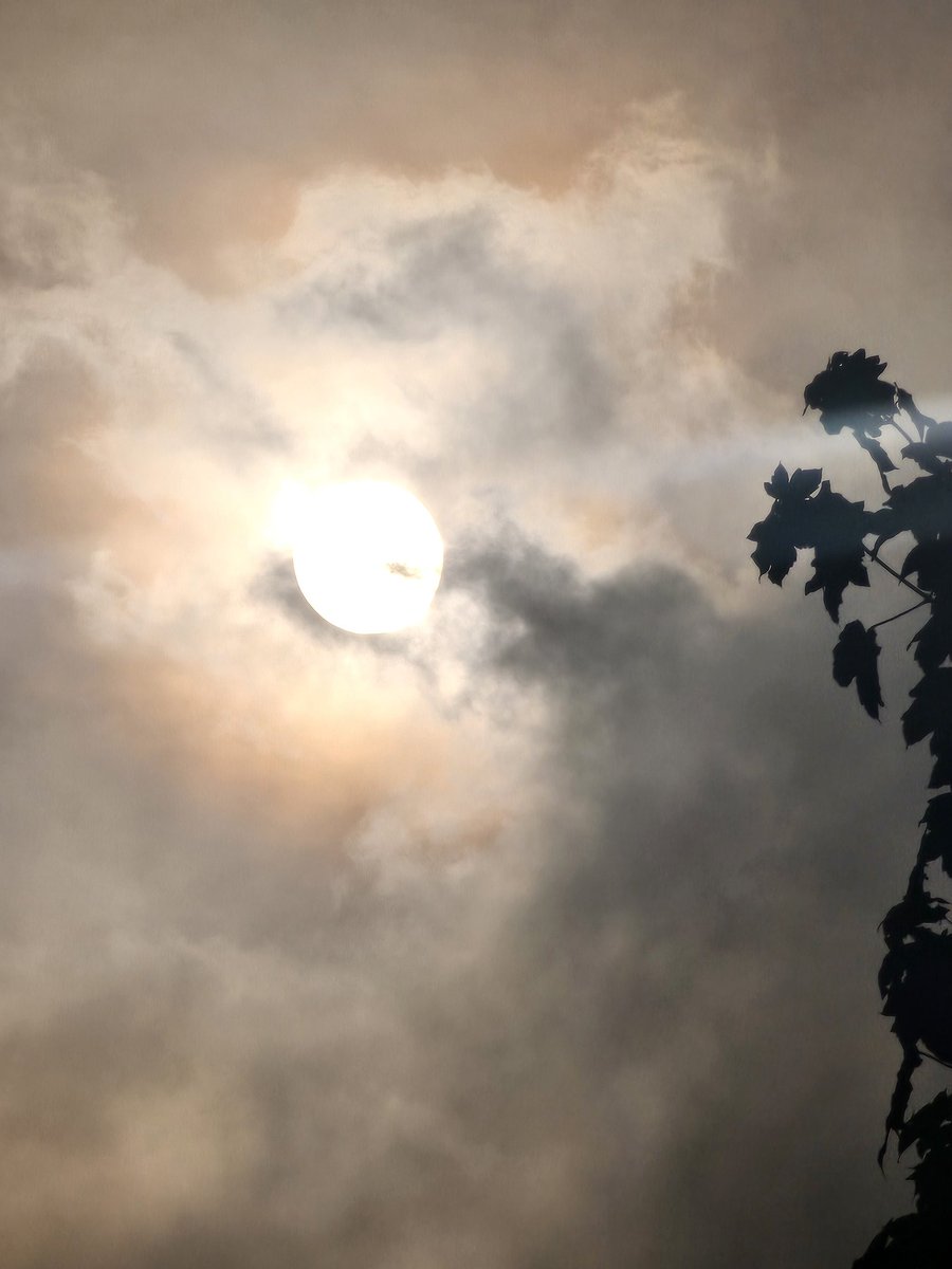 The sun is shining through the clouds