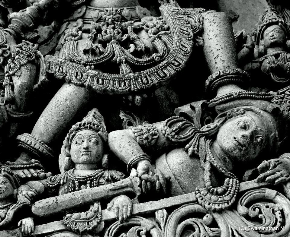 At the feet of Varāha in Belur,
an asura lies pinned — head turned, eyes wide.
There is no cry. No clenched fist.
Just a look of stunned awareness.
The body twists, but the face remains composed —
not resisting, almost registering who stands above.
ಬೆಳೂರಿನ ವರಾಹ ಶಿಲ್ಪದಲ್ಲಿ,
ಅವನ