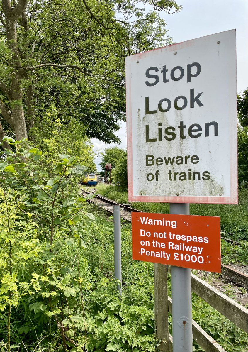 WeavinWeave's tweet image. Some British Rail signs and 43089 in the distance at Stanhope after arriving with 1Z43, the ‘Locomotion and Weardale’ railtour from London Kings Cross on 31 May 2025. @UKRailtours @125Group @WeardaleRailway