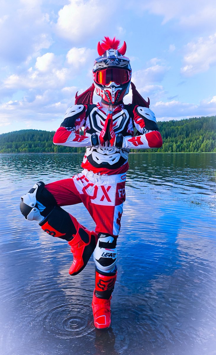 ⚪️🔴In the middle of the wild, the motocross boy stands in the lake. His helmet reflects the sunlight, and his eyes stay locked forward behind the goggles. The water moves around his boots. He’s waiting—focused and ready.🔴⚪️