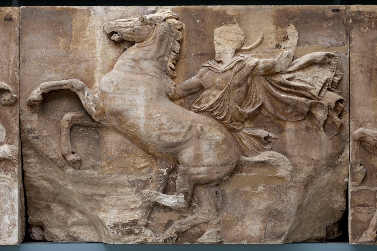 Block 8 of the Parthenon West Frieze, possibly crafted by Phidias himself.

Ἣ θεὸς ἦλθ᾿ ἐπὶ γῆν ἐξ οὐρανοῦ, εἰκόνα δείξων,
Φειδία· ἢ σύ γ᾿ ἔβης τὸν θεὸν ὀψόμενος.
-
Either god came from heaven to earth to show you his image, Phidias, or you did go to see god.