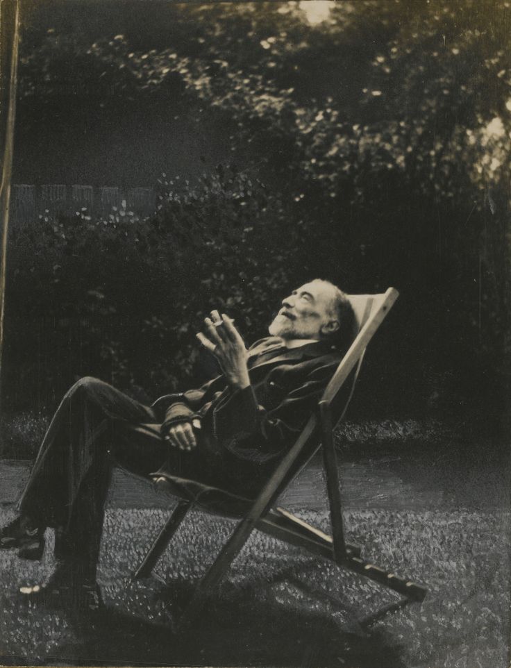 Joseph Conrad enjoying a smoke in his garden in Bishopsbourne, England.