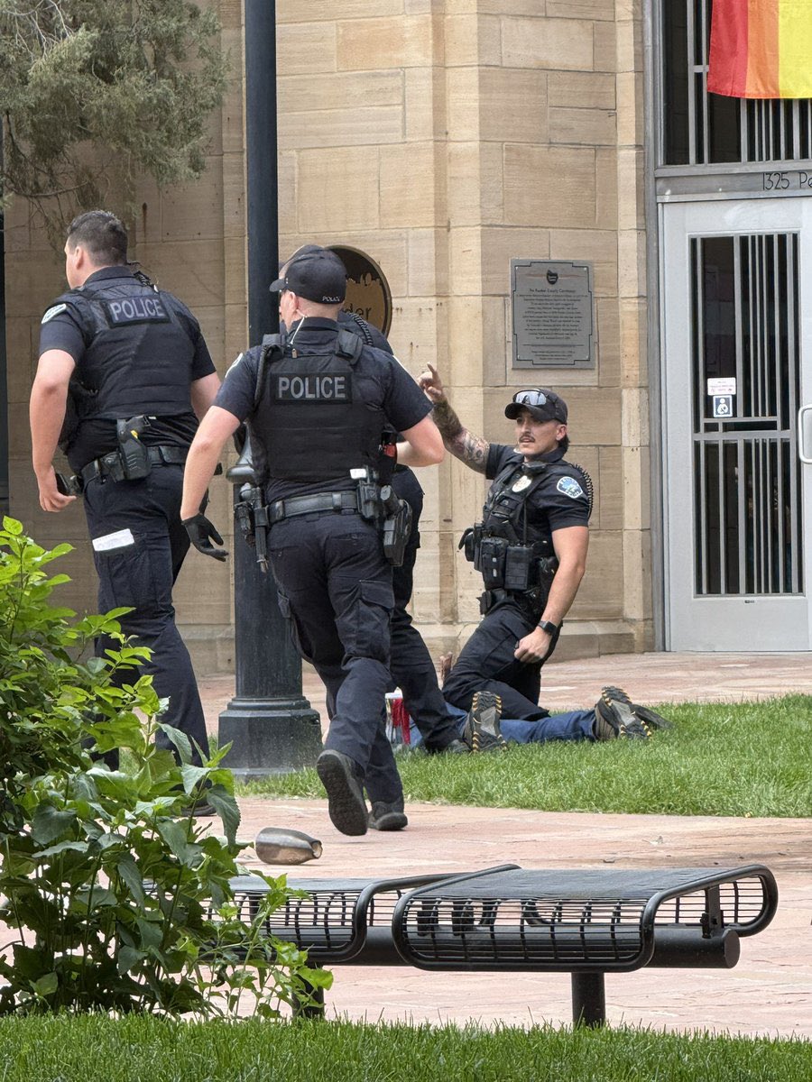 Clearer images of the suspect who threw some kind of incendiary device, likely a molotov cocktail, at supporter of Israel earlier in Boulder, Colorado. He appears to be holding the devices he used to commit the attack in the picture, right before he is arrested by Boulder Police.
