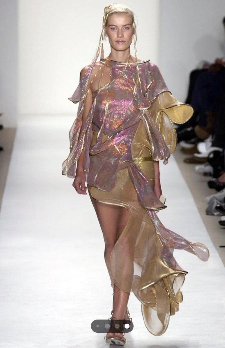 Calvinwaldorf's tweet photo. finding out this Mariah Carey dress is real! from the brand “Threeasfour” but she cut it out with her personal scissors to show more leg and it ended up with two dresses…iconic. https://t.co/8LM1Ldcvj8
