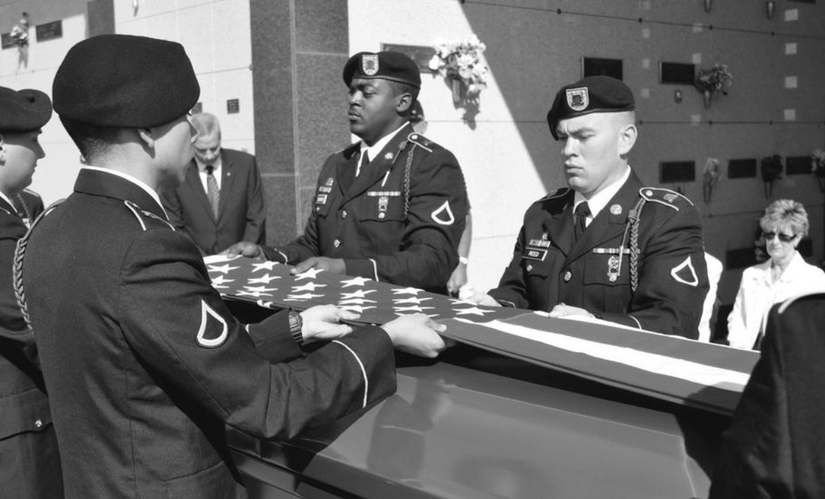 The Honor Guard from Ft. Riley folds the flag that draped a homeless veteran's casket at his funeral.
Instead of being buried in a pauper's grave an ending that would have only reinforced his anonymous last years the Vietnam veteran was again recognized as Army Sgt. Patrick