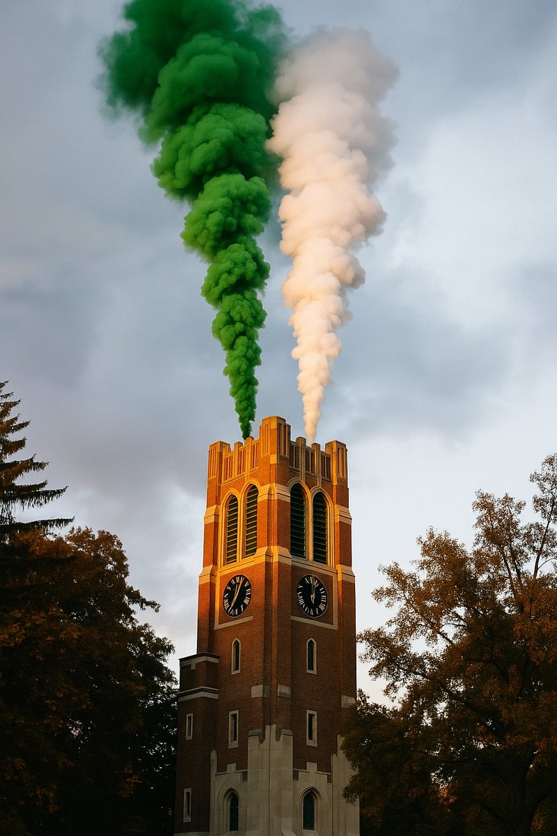 Green and white smoke billows out of the Beaumont Tower signaling that MSU has selected a new Athletic Director