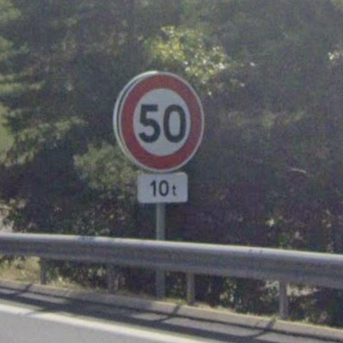 Does anyone know how new cars with speed limit warnings cope with signs like these supplementary limits on the Autoroutes? 
Are they smart enough to ignore them, or do they bong at you like billy-o if you maintain the actual limit?