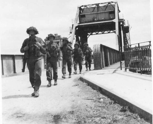 DrHelenFry's tweet photo. British troops cross Pegasus Bridge over the Caen Canal at Bénouville, 9th June 1944: https://t.co/mTntzWVAfh
