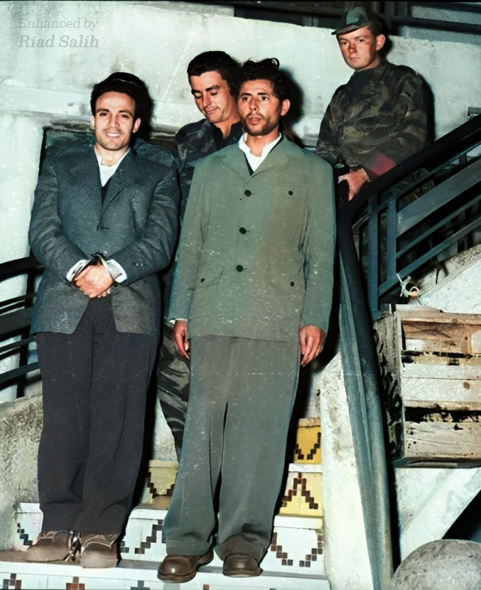 MOuerthi's tweet image. For those who don't understand the importance of the smile, she announced it before the kidnapping, she's emulating Larbi Ben M'hidi an Algerian resistance fighter who refused to show himself bowing or be defeated by the colonisers. 
He faced the execution with a smile, unbroken.