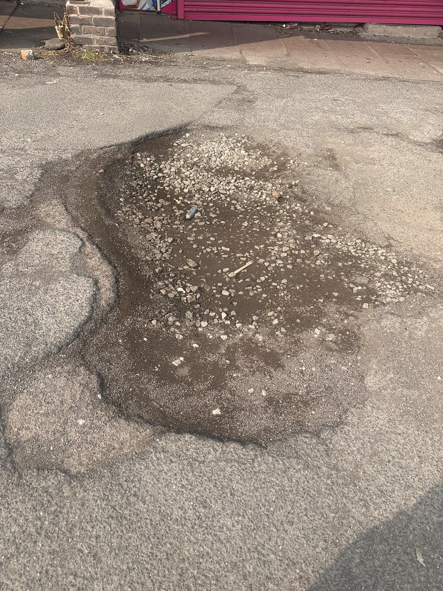LabourWollatonW's tweet image. This crater (giant pothole) is at the car park at Crown Island shops. Apparently no one knows who owns the car park or if they do can’t get hold of them. So it just gets bigger and bigger. Maybe make it into a pond? Or just find the owner and make them take action @MyNottingham