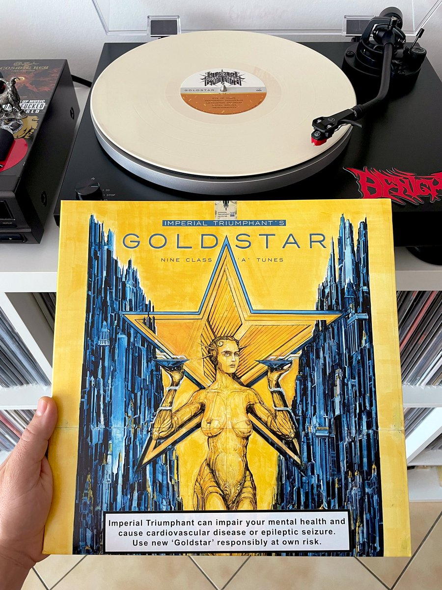 #Nowspinning: 

Imperial Triumphant - “Goldstar”(2025)🇺🇸🔥🔥🔥

Format: #vinyl 180g LTD. Gatefold Creamy White, Limited to 300 units!

Label: Century Media Records 

Artwork: Zoigniew Bielak

Style: Avant-garde/Black Metal/Death Metal