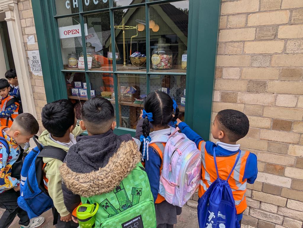 Year 1 has been transported back in time to the Victorian era. Here are some children looking at an old sweet shop.