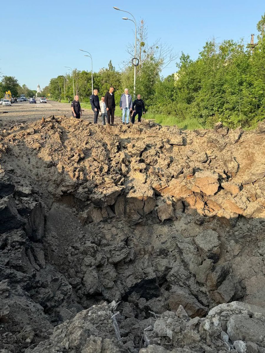 The mayor of Kharkiv showed a photo of a crater in the Kyivskyi district caused by a Russian ballistic missile strike last night.