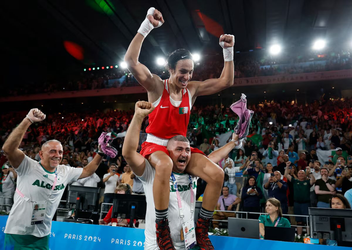 Remember this?

Can’t shake a woman’s hand but they’ll let this ‘woman’ ride on the shoulders of a man?

Lying cheats. Imane Khelif is a man. They always knew.