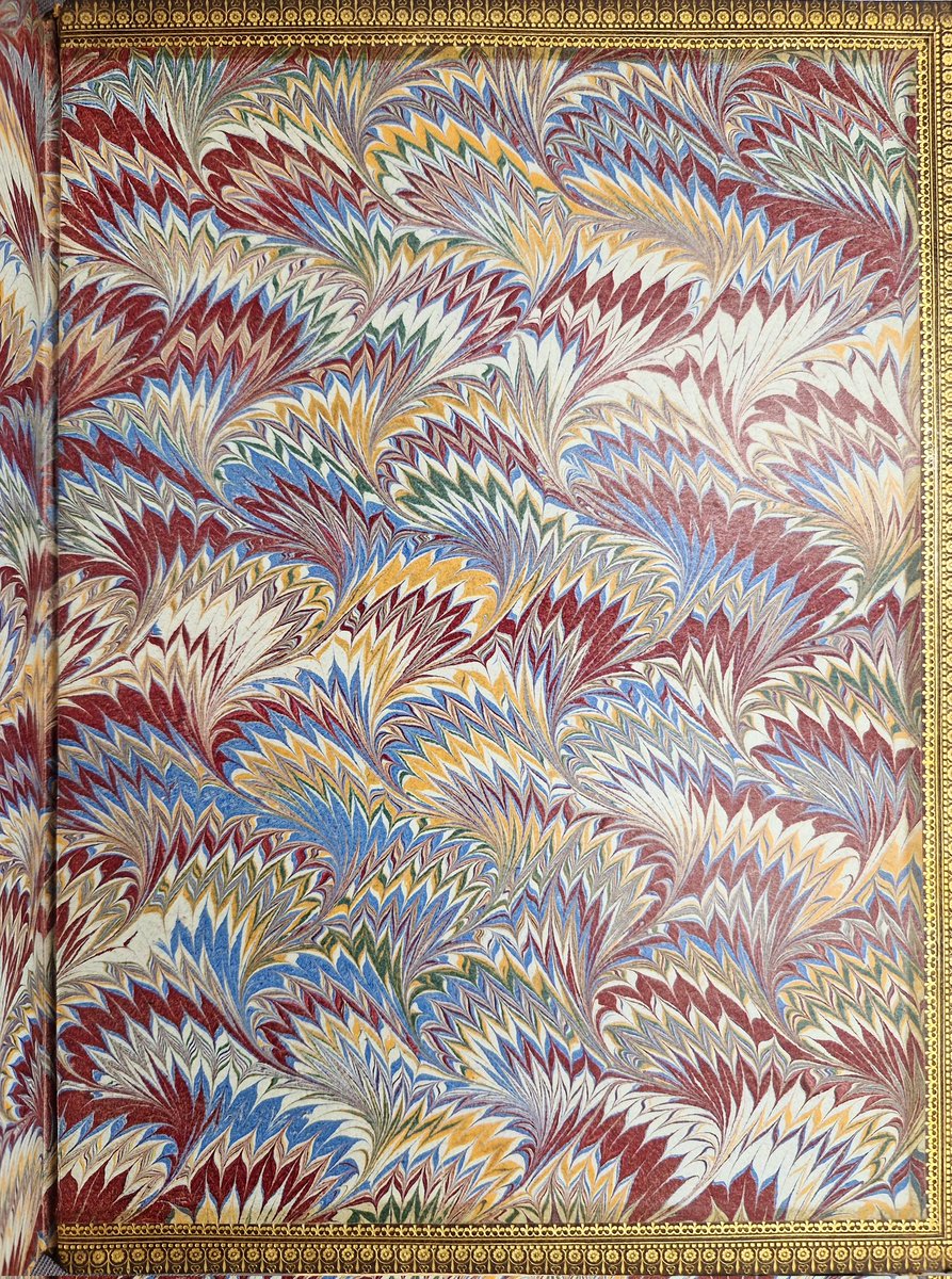 It's a #marbledmonday with some 19th century peacock-style endpapers on my desk today.