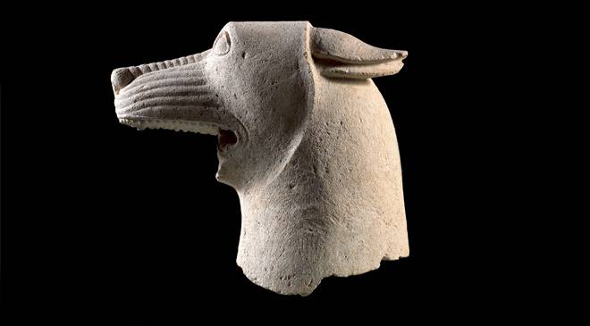 Stunning Iberian sculpture of a wolf head from El Pajarillo, Jaén, Andalucía, early 4th BCE. The ears pinned back and wrinkled muzzle suggest a threatening posture. It forms part of large sculpture telling story of hero who frees a youth from the wild animal. Museo de Jaén